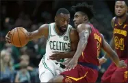  ?? MICHAEL DWYER - THE ASSOCIATED PRESS ?? Cleveland Cavaliers’ Collin Sexton (2) fouls Boston Celtics’ Kemba Walker, left, during the first half of an NBA preseason basketball game in Boston, Sunday, Oct. 13, 2019.