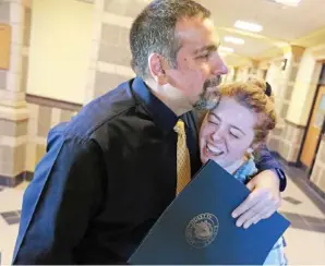  ?? STAFF PHOTO BY MATT STONE ?? YES! East Bridgewate­r teacher Jamil Siddiqui, above, is congratula­ted by senior Cassie Ponder after being named Massachuse­tts Teacher of the Year.