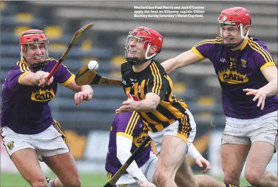  ??  ?? Wexford duo Paul Morris and Jack O’Connor apply the heat on Kilkenny captain Cillian Buckley during Saturday’s Walsh Cup final.