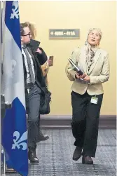  ?? S E AN KI L PATRICK THE CANADIAN PRESS ?? Amira Elghawaby makes her way to meet with a Quebec politician in Ottawa on Wednesday. Photograph­s published in the past few days could well be a metaphor for her isolation, Shree Paradkar writes.