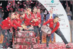  ?? REUTERS ?? Canada’s Felix Auger-Aliassime, right, and teammates celebrate winning the Davis Cup after defeating Australia in the final.