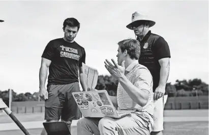  ?? JEFF HING/POMONA COLLEGE ?? Pomona students Jake Lialios, left, and Jack Hanley perform field research with Frank Pericolosi. Pericolosi teaches a baseball analytics class and the school is developing a reputation of landing graduates in major league front offices.