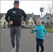  ??  ?? Luke out for a jog with his dad Patrick.