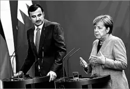  ?? SEAN GALLUP/GETTY ?? Sheikh Tamim bin Hamad Al Thani and Chancellor Angela Merkel meet Friday in Berlin.