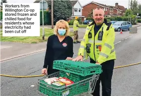  ??  ?? Workers from Willington Co-op stored frozen and chilled food for residents whose electricit­y had been cut off