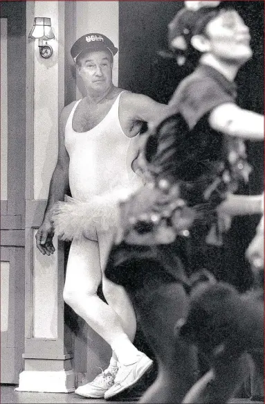  ?? DAVE DARNELL / THE COMMERCIAL APPEAL FILES ?? They weren’t called the Showboat s for nothing. Former Memphis Showboat s coach Pepper Rodgers rela xes in his costume a s Tinker Bell during a dress rehearsal for Playhouse on the Square’s spoof on Peter Pan in 1988.