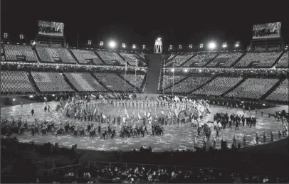  ?? The Associated Press ?? CLOSING CEREMONY: Athletes walk into the stadium during the closing ceremony of the 2018 Winter Olympics on Sunday in Pyeongchan­g, South Korea.