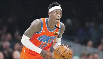  ?? Michael Dwyer Associated Press ?? OKLAHOMA CITY’S Dennis Schroder grew up in Germany, which has made strides in confrontin­g its past.