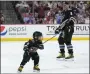 ?? LYNNE SLADKY — AP ?? Washington's Alex Ovechkin smiles at his son Sergei, 4, after he scored a goal during the NHL All Star Skills Showcase.