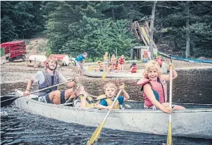  ?? CAMP CROSSROADS ?? Life jackets? Check. Paddles? Check. Then let’s get going! With canoe safety lessons learned on land, the kids and their leader are keen to make waves at Camp Crossroads.