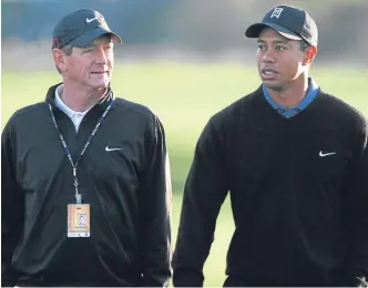  ??  ?? Swing coach Hank Haney (left) worked with Tiger Woods for six years.