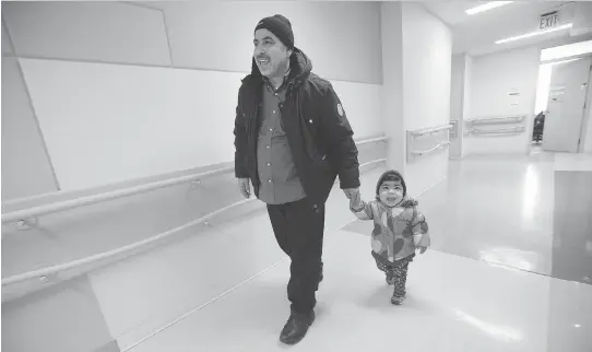  ?? PHOTOS: WAYNE CUDDINGTON ?? Mouhamad Al Rahmou and four-year-old daughter Shahad, who arrived in Canada as government-sponsored refugees last year, on one of their visits to the Children’s Hospital of Eastern Ontario. The recent refugee influx has provided a stress test of sorts...