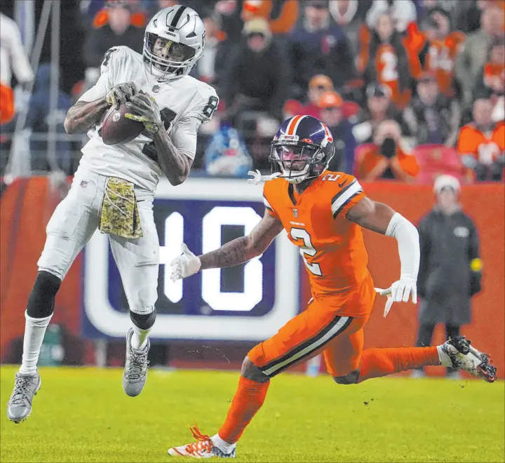  ?? Bart Young
The Associated Press ?? Raiders receiver Keelan Cole made just his fourth catch of the season last Sunday, but it was a pivotal grab in the game-tying drive in the final minutes against the Broncos.