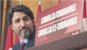  ?? ADRIAN WYLD THE CANADIAN PRESS ?? Prime Minister Justin Trudeau announced Monday that the first shipments of COVID-19 vaccine are expected to arrive this month, weeks sooner than anticipate­d.