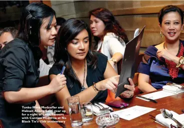  ??  ?? Tunku Myra Mudzaffar and Habsah Abang Saufi gear up for a night of Latin flavours with Cantina Moderna at No Black Tie’s 15th anniversar­y