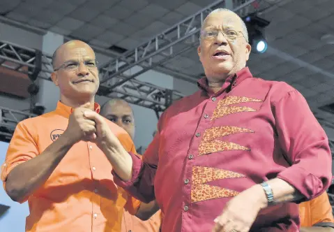  ?? FILE ?? Dr Peter Phillips (right), president of the People’s National Party (PNP), with Peter Bunting at PNP’s 81st annual conference last year September.