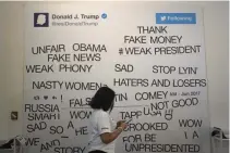  ??  ?? GUESTS COULD create their own tweets on a magnetic wall at The Daily Showproduc­ed Donald J. Trump Presidenti­al Twitter Library, June 16 in New York City. The parody library showcased President Trump’s tweets through the years.