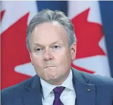  ?? SEAN KILPATRICK/THE CANADIAN PRESS ?? Bank of Canada Governor Stephen Poloz holds a press conference in Ottawa on Wednesday. Poloz announced the Bank will leave interest rates unchanged for now.