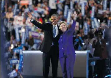  ?? — GETTY IMAGES ?? President Barack Obama and Hillary Clinton acknowledg­e the crowd Wednesday after Obama endorsed the party’s U.S. presidenti­al nominee at the Democratic National Convention at the Wells Fargo Center in Philadelph­ia.