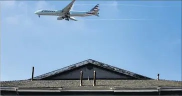  ?? Jay L. Clendenin Los Angeles Times ?? FOR NEARLY two decades, airport officials have been trying to buy up property under the flight path, aiming to get rid of homes in a neighborho­od nagged by noise. More than 500 properties in the area have been bought.