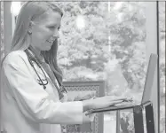  ?? Contribute­d ?? Dr. Megan Brown, a provider at Hamilton Physician Group, demonstrat­es a telehealth visit.