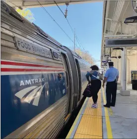  ?? MEDIANEWS GROUP ?? A passenger boards the Amtrak train at the Paoli station. Berks County officials are moving forward on plans to establish a passenger railroad authority as part of the effort to restore service to Reading.