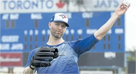  ?? FRANK GUNN/THE CANADIAN PRESS ?? Toronto Blue Jays’ starting pitcher J.A. Happ throws at Blue Jays’ spring training in Dunedin, Fla., on Tuesday.