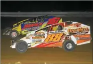  ?? RICK KEPNER - FOR DIGITAL FIRST MEDIA ?? Craig VonDohren (88) battles with Duane Howard (357) during the modified feature at Big Diamond on Aug. 25. Von Dohren shored up track points title on the night.