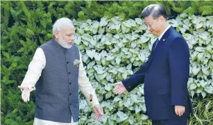  ?? (Danish Siddiqui/Reuters) ?? INDIAN PRIME MINISTER Narendra Modi and Chinese President Xi Jinping appear at a summit last year in Goa, India.