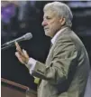  ?? STAFF PHOTO BY DOUG STRICKLAND ?? Former UTC football coach Buddy Green speaks about former Mocs receiver Terrell Owens during Owens’ Pro Football Hall of Fame induction event Saturday at McKenzie Arena.