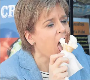  ?? Picture: PA. ?? SNP leader Nicola Sturgeon stops for an ice cream after an election campaign visit to Scottish Gas HQ in Granton, Edinburgh.