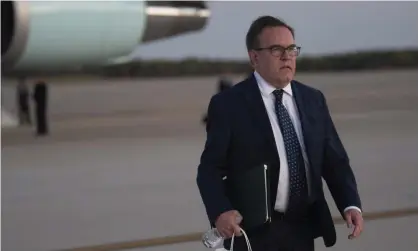  ??  ?? The EPA administra­tor, Andrew Wheeler, walks from Air Force One at Andrews air force base, Maryland, on 23 October 2019. Photograph: Kevin Wolf/AP