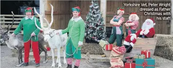  ??  ?? Christmas
Yorkshire Vet, Peter Wright dressed as Father Christmas with his staff