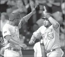  ?? AP/NAM Y. HUH ?? Kansas City’s Melky Cabrera (right) celebrates with Lorenzo Cain after hitting a two-run home run in the eighth inning of Saturday’s game against the White Sox in Chicago.