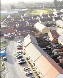  ?? Picture: HawkEye Aerial Media ?? Left: Queues build up near the entrance to Maidstone Hospital and right: New housing built in Barming