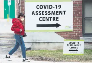  ?? NATHAN DENETTE THE CANADIAN PRESS ?? A woman arrives at a COVID-19 assessment centre at Michael Garron Hospital. Ontario reported on Wednesday that it completed 2,763 tests the previous day, its largest single-day number yet.