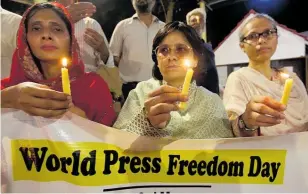  ?? Photo / AP ?? Pakistani journalist­s observe World Press Freedom Day this month.