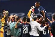  ?? (AP/David Ramos) ?? Paris Saint-Germain players celebrate Tuesday after beating Leipzig 3-0 in the Champions League semifinals in Lisbon, Portugal.