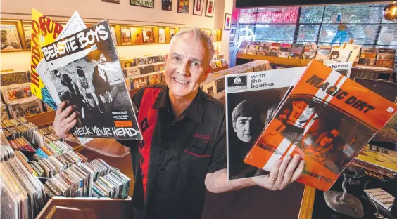  ??  ?? Pat Monaghan, owner of Rock Steady Records in Melbourne, says his customers are tribal in their taste. Picture: David Geraghty