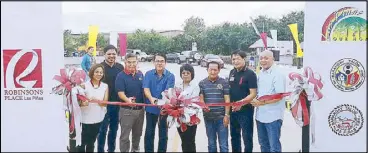  ??  ?? Leading the ribbon-cutting ceremony for the bridge opening are (from left) RLC regional operation manager Mylene del Rosario; Las Piñas city councilors Peewee Aguilar and Henry Medina; Paramount Village Homeowners president Ding Alipalo; Las Piñas city...