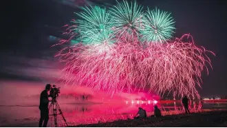  ??  ?? Visitors enjoy the fireworks lighting up the night sky on Tuesday.