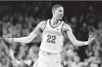  ?? David Purdy / Getty Images ?? Iowa State’s Tyrese Haliburton celebrates making a crucial 3-pointer in the second half against Kansas.