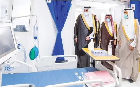  ?? SPA ?? Madinah Governor Prince Faisal bin Salman and Health Minister Dr. Tawfiq Al-Rabiah inspect the Nujood Medical Center in Madinah on Wednesday.