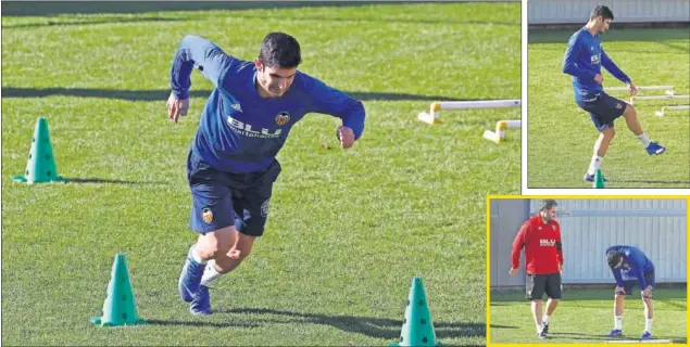  ??  ?? INTENSA JORNADA DEL PORTUGUÉS. Guedes se ejercitó en solitario en la jaula de Paterna, bajo la atenta mirada de un recuperado­r del cuerpo técnico de Marcelino.