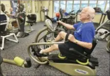  ?? ART GENTILE/THE INTELLIGEN­CER VIA AP ?? In this Aug. 7, 2017, photo, Jim Morgan, 90, works out in the Fitness Center next to the indoor pool at Ann’s Choice in Warminster, Pa. Wellness is one of the main concerns when Baby Boomers research into the retirement communitie­s in their future.