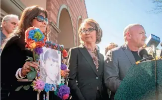  ?? THE REPUBLIC ?? Roxanna Green, left, mother of Christina Taylor-Green, stands with former U.S. Rep. Gabrielle Giffords and her husband, Mark Kelly, on March 6, 2013.