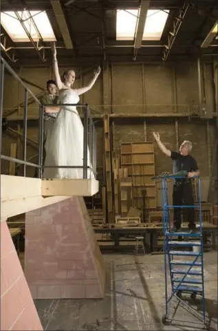  ?? HAMILTON SPECTATOR FILE PHOTO ?? Lou Zamprogna directs Evan Smith, left, and Jamie McRoberts during rehearsal for the 2006 production of "Evita."