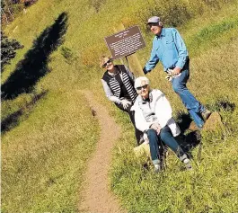  ?? COURTESY PHOTO ?? From left, Libby Jorgensen Mims, Jean Winsor Jorgensen and Robert Jorgensen are shown with a newly placed sign at the Winsor Trailhead in the Pecos Wilderness.