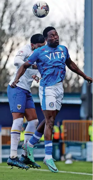  ?? Www.mphotograp­hic.co.uk ?? ●●Isaac Olaofe gets up above the Dons defence