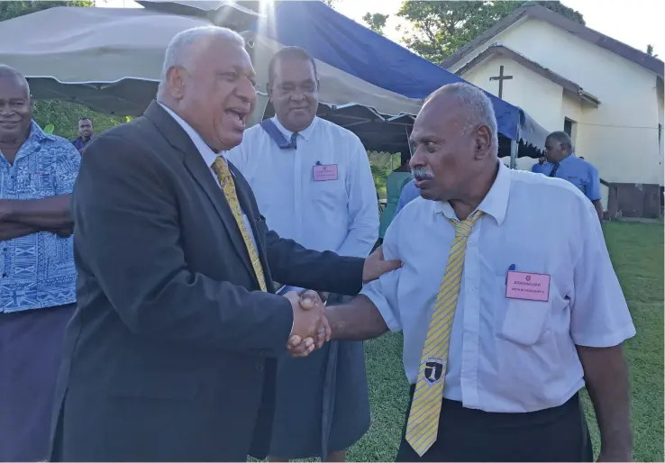  ?? Photo: Lusiana Tuimaisala ?? Prime Minister Voreqe Bainimaram­a with Buretu district representa­tive Atunaisa Loco after the opening of the Tailevu Provincial Meeting at Naisausau Village in Namara on November 24, 2022.